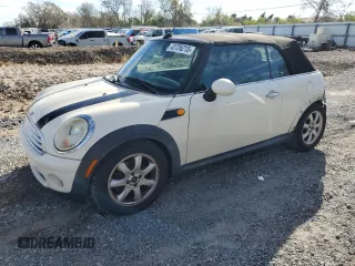 2010 MINI Convertible with VIN WMWMR3C55ATU97172, listed as a Copart auction lot 42726215 with 99,164 mi miles and Salvage Title. Bid and sale history available at DreamBid. Image 1.