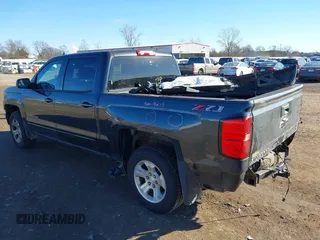 2018 Chevrolet Silverado 1500 LT with VIN 3GCUKRECXJG321396, listed as a IAAI auction lot 40851181 with 137,348 mi miles. Bid and sale history available at carsss.com. Image 3.