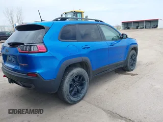 2022 Jeep Cherokee Trailhawk z VIN 1C4PJMBX4ND513488, wystawiony jako IAAI lot #42137114 z przebiegiem 12 306 mil mil oraz . Historia ofert i sprzedaży dostępna na DreamBid. Obrazek 4.