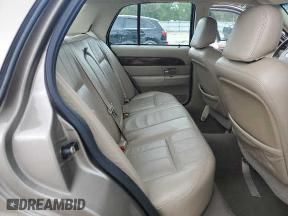 2005 Mercury Grand Marquis LS Premium z VIN 2MEFM75W15X660639, wystawiony jako Copart lot #56580605 z przebiegiem 149 136 mil mil oraz Szkody całkowita. Historia ofert i sprzedaży dostępna na DreamBid. Obrazek 10.