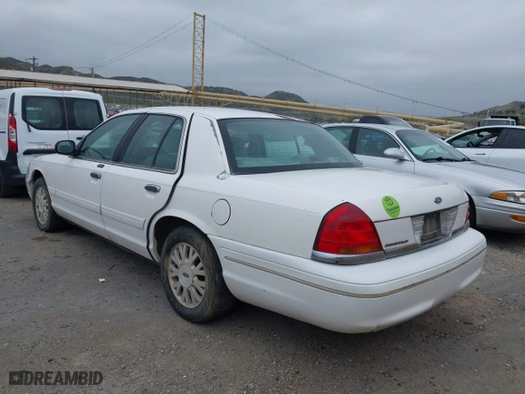 2003 Ford Crown Victoria LX with VIN 2FAFP74WX3X154904, listed as a IAAI auction lot 42094274 with 123,579 mi miles. Bid and sale history available at carsss.com. Image 3.