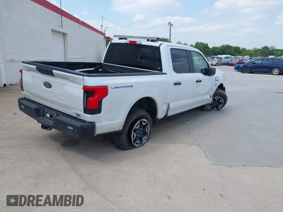 2023 Ford F-150 Lightning Pro with VIN 1FTVW1EL2PWG18764, listed as a IAAI auction lot 41908278 with 16,276 mi miles and . Bid and sale history available at DreamBid. Image 4.