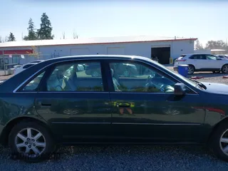 2000 Toyota Avalon XL z VIN 4T1BF28B2YU092348, wystawiony jako IAAI lot #42271599 z przebiegiem 179 560 mil mil oraz . Historia ofert i sprzedaży dostępna na DreamBid. Obrazek 14.