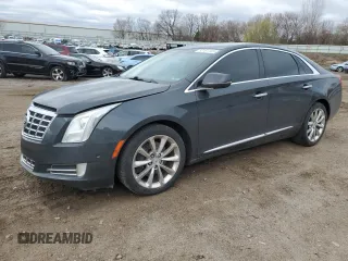 2014 Cadillac XTS Luxury z VIN 2G61M5S36E9324924, wystawiony jako Copart lot #53151105 z przebiegiem 149 574 mil mil oraz Tytuł czysty. Historia ofert i sprzedaży dostępna na DreamBid. Obrazek 1.