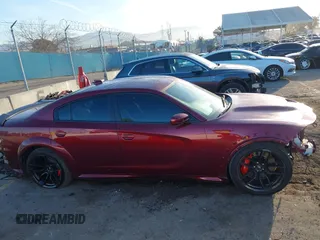 2022 Dodge Charger Scat Pack Widebody with VIN 2C3CDXGJ5NH189146, listed as a IAAI auction lot 41603805 with 30,212 mi miles and . Bid and sale history available at DreamBid. Image 14.
