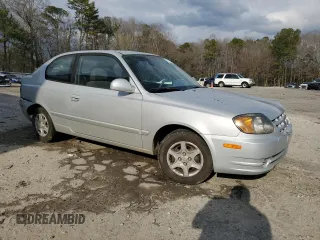 2003 Hyundai Accent GL with VIN KMHCG35CX3U270374, listed as a Copart auction lot 47240325 with 122,739 mi miles and Salvage Title. Bid and sale history available at carsss.com. Image 4.