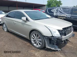 2014 Cadillac XTS Luxury z VIN 2G61M5S38E9291182, wystawiony jako IAAI lot #42495838 z przebiegiem 104 941 mil mil oraz . Historia ofert i sprzedaży dostępna na DreamBid. Obrazek 1.