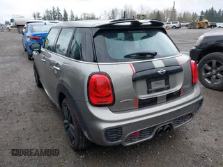 2017 MINI Hardtop 4 Door Cooper S z VIN WMWXU3C58H2D33073, wystawiony jako IAAI lot #41913081 z przebiegiem 51 631 mil mil oraz . Historia ofert i sprzedaży dostępna na DreamBid. Obrazek 3.