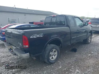 2003 Ford F-150 XL with VIN 2FTRX18W73CA80587, listed as a IAAI auction lot 42119924 with 222,990 mi miles. Bid and sale history available at carsss.com. Image 4.