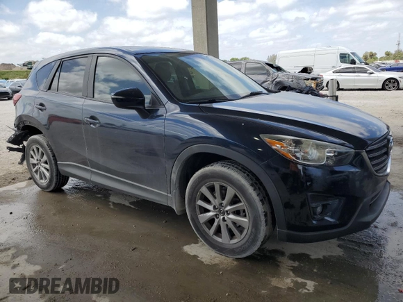 2016 Mazda CX-5 Touring with VIN JM3KE2CY9G0834048, listed as a Copart auction lot 54491535 with 116,328 mi miles and Salvage Title. Bid and sale history available at DreamBid. Image 4.