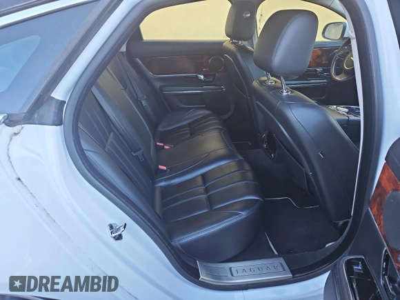 2013 Jaguar XJ с VIN SAJWJ1CD7D8V49599, выставлен на аукционе Copart как лот 43230675 с пробегом 133 163 миль миль и Чистый • Clean title. История ставок и продаж доступна на DreamBid. Изображение 6.