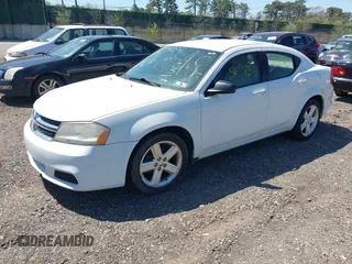 2013 Dodge Avenger SE with VIN 1C3CDZABXDN551796, listed as a IAAI auction lot 42142302 with 999,999 mi miles. Bid and sale history available at carsss.com. Image 2.