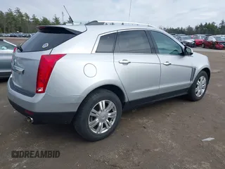 2014 Cadillac SRX Luxury Collection z VIN 3GYFNEE33ES670356, wystawiony jako IAAI lot #42008087 z przebiegiem 59 953 mil mil oraz . Historia ofert i sprzedaży dostępna na DreamBid. Obrazek 4.