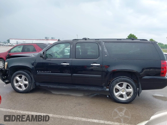 2007 Chevrolet Suburban LTZ with VIN 1GNFK16367J196596, listed as a IAAI auction lot 42392224 with 100,774 mi miles and . Bid and sale history available at DreamBid. Image 14.