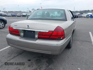 2003 Mercury Grand Marquis LS Premium z VIN 2MEFM75W73X653224, wystawiony jako IAAI lot #42038256 z przebiegiem 145 374 mil mil oraz . Historia ofert i sprzedaży dostępna na DreamBid. Obrazek 4.