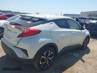 2019 Toyota C-HR XLE with VIN JTNKHMBX7K1023674, listed as a IAAI auction lot 42021152 with 106,450 mi miles. Bid and sale history available at carsss.com. Image 4.