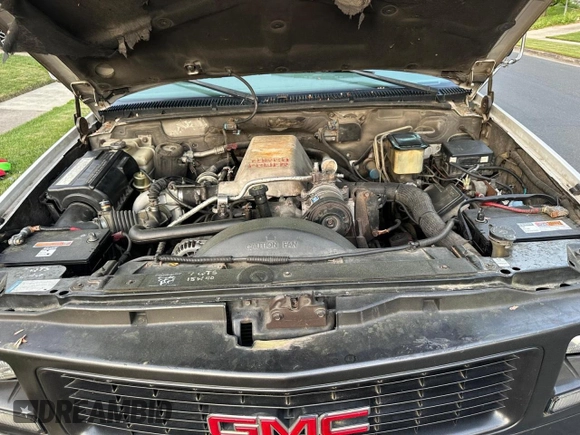 2000 GMC Sierra 1500 with VIN 1GDKC34F9YF421333, listed as a Copart auction lot 57167145 with 120,490 mi miles and Clean Title. Bid and sale history available at DreamBid. Image 7.