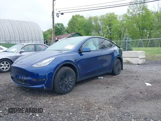 2023 Tesla Model Y Long Range z VIN 7SAYGDEE6PF603981, wystawiony jako IAAI lot #42133348 z przebiegiem 28 566 mil mil oraz . Historia ofert i sprzedaży dostępna na DreamBid. Obrazek 18.