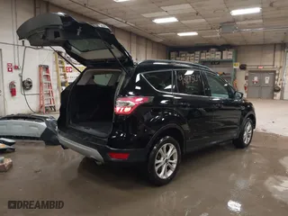 2017 Ford Escape SE with VIN 1FMCU9GDXHUA07522, listed as a IAAI auction lot 40875214 with 114,175 mi miles. Bid and sale history available at carsss.com. Image 4.