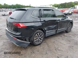 2021 Volkswagen Tiguan SE with VIN 3VV3B7AX6MM021502, listed as a IAAI auction lot 42243705 with 60,988 mi miles and . Bid and sale history available at DreamBid. Image 4.