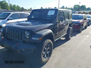2022 Jeep Wrangler Unlimited Rubicon with VIN 1C4HJXFNXNW149063, listed as a IAAI auction lot 42130171 with 33,961 mi miles and . Bid and sale history available at DreamBid. Image 2.