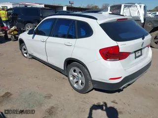 2015 BMW X1 sDrive28i with VIN WBAVM1C51FVZ94433, listed as a IAAI auction lot 41425205 with 148,346 mi miles. Bid and sale history available at carsss.com. Image 3.