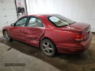 2001 Mazda Millenia S z VIN JM1TA222111707236, wystawiony jako Copart lot #54690874 z przebiegiem 107 530 mil mil oraz Szkody całkowita. Historia ofert i sprzedaży dostępna na DreamBid. Obrazek 2.