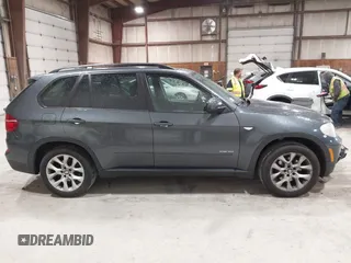 2012 BMW X5 35i z VIN 5UXZV4C59CL985715, wystawiony jako IAAI lot #42307586 z przebiegiem 105 147 mil mil oraz . Historia ofert i sprzedaży dostępna na DreamBid. Obrazek 13.