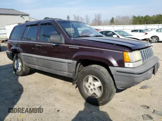 1993 Jeep Grand Cherokee Laredo with VIN 1J4GZ58S8PC656490, listed as a Copart auction lot 49377485 with 236,215 mi miles and Salvage Title. Bid and sale history available at carsss.com. Image 4.