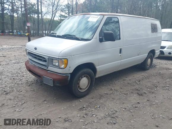 2001 Ford Econoline Cargo with VIN 1FTRE14261HA74696, listed as a IAAI auction lot 41915335 with 124,282 mi miles. Bid and sale history available at carsss.com. Image 2.