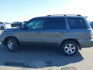 2007 Honda Pilot EX-L with VIN 2HKYF18667H501911, listed as a IAAI auction lot 41752356 with 267,277 mi miles and . Bid and sale history available at DreamBid. Image 14.