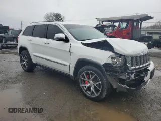 2013 Jeep Grand Cherokee Overland with VIN 1C4RJECT2DC590911, listed as a Copart auction lot 42939405 with 136,673 mi miles and Salvage Title. Bid and sale history available at carsss.com. Image 4.