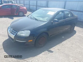 2008 Volkswagen Jetta Sedan S with VIN 3VWJM71K28M056528, listed as a IAAI auction lot 42007781 with 151,547 mi miles. Bid and sale history available at carsss.com. Image 2.
