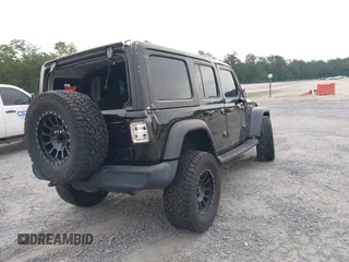 2021 Jeep Wrangler Unlimited Willys z VIN 1C4HJXDM5MW859724, wystawiony jako IAAI lot #42311203 z przebiegiem 71 887 mil mil oraz . Historia ofert i sprzedaży dostępna na DreamBid. Obrazek 4.