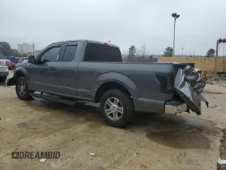 2015 Ford F-150 XL with VIN 1FTEX1C8XFFA48801, listed as a Copart auction lot 43728595 with 144,829 mi miles and Salvage Title. Bid and sale history available at carsss.com. Image 2.