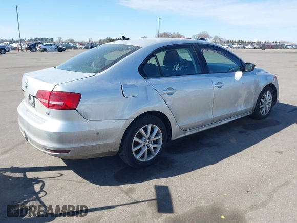 2015 Volkswagen Jetta Sedan 1.8T SE with VIN 3VWD17AJXFM324283, listed as a IAAI auction lot 41769785 with 103,686 mi miles. Bid and sale history available at carsss.com. Image 4.