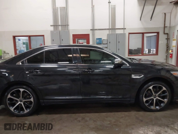 2014 Ford Taurus Limited z VIN 1FAHP2J8XEG112565, wystawiony jako IAAI lot #41554413 z przebiegiem 180 870 mil mil oraz . Historia ofert i sprzedaży dostępna na DreamBid. Obrazek 13.