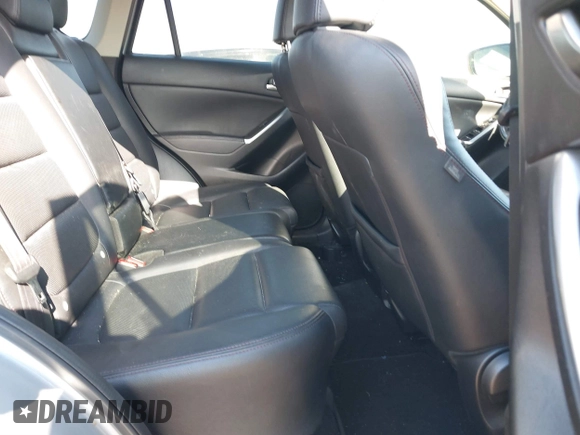 2016 Mazda CX-5 Grand Touring z VIN JM3KE2DY3G0712249, wystawiony jako IAAI lot #37910910 z przebiegiem 262 058 mil mil oraz . Historia ofert i sprzedaży dostępna na DreamBid. Obrazek 8.
