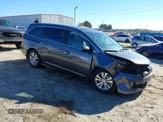 2016 Honda Odyssey EX-L with VIN 5FNRL5H69GB047902, listed as a IAAI auction lot 40795564 with 124,788 mi miles. Bid and sale history available at carsss.com. Image 1.