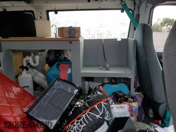 1995 Ford Econoline Wagon XL z VIN 1FBJS31H0SHB49053, wystawiony jako Copart lot #44952525 z przebiegiem Nie podano mil oraz Szkoda całkowita • Salvage title. Historia ofert i sprzedaży dostępna na DreamBid. Obrazek 12.