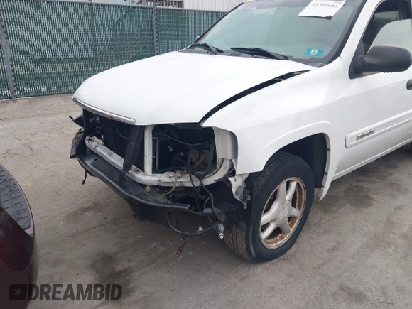 2005 GMC Envoy SLT with VIN 1GKDT13S952190876, listed as a IAAI auction lot 41308686 with 244,774 mi miles. Bid and sale history available at carsss.com. Image 6.