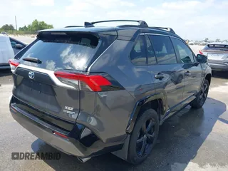 2021 Toyota RAV4 Hybrid XSE with VIN 2T3E6RFV8MW026973, listed as a IAAI auction lot 42052289 with 94,857 mi miles and . Bid and sale history available at DreamBid. Image 4.