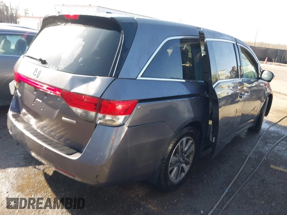 2015 Honda Odyssey Touring Elite z VIN 5FNRL5H9XFB067679, wystawiony jako IAAI lot #41913306 z przebiegiem 199 482 mil mil oraz . Historia ofert i sprzedaży dostępna na DreamBid. Obrazek 4.