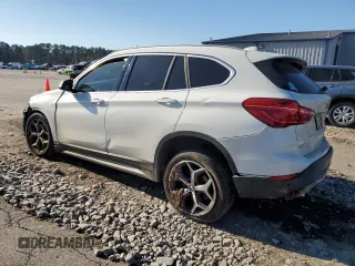 2019 BMW X1 sDrive28i with VIN WBXHU7C53K3H45694, listed as a Copart auction lot 85804084 with 151,645 mi miles and Salvage Title. Bid and sale history available at DreamBid. Image 2.