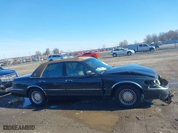 1999 Mercury Grand Marquis LS with VIN 2MEFM75W2XX641598, listed as a IAAI auction lot 41112721 with 152,801 mi miles. Bid and sale history available at carsss.com. Image 13.