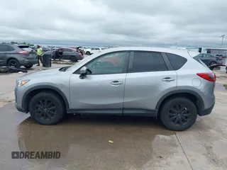 2014 Mazda CX-5 Touring z VIN JM3KE2CY8E0369145, wystawiony jako IAAI lot #42462985 z przebiegiem 155 480 mil mil oraz . Historia ofert i sprzedaży dostępna na DreamBid. Obrazek 14.