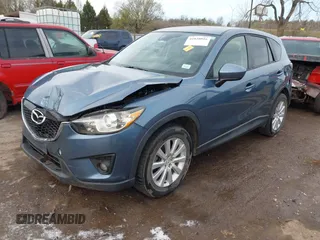 2014 Mazda CX-5 Grand Touring with VIN JM3KE4DYXE0403192, listed as a IAAI auction lot 41828016 with 156,270 mi miles and . Bid and sale history available at carsss.com. Image 2.