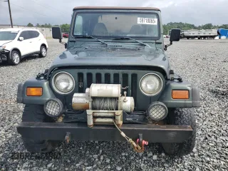 1998 Jeep Wrangler Sport with VIN 1J4FY19S5WP795781, listed as a Copart auction lot 59718065 with 208,416 mi miles and Salvage title. Bid and sale history available at DreamBid. Image 5.