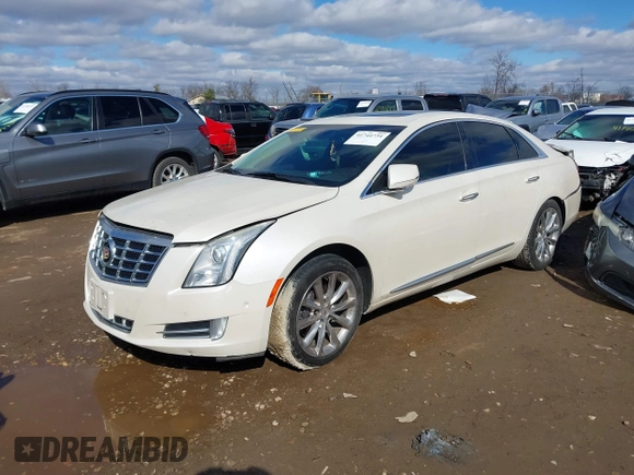 2014 Cadillac XTS Premium with VIN 2G61P5S38E9124277, listed as a IAAI auction lot 41744734 with 136,223 mi miles. Bid and sale history available at carsss.com. Image 2.