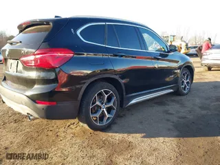 2017 BMW X1 xDrive28i with VIN WBXHT3Z33H4A65699, listed as a IAAI auction lot 41752257 with 66,306 mi miles. Bid and sale history available at carsss.com. Image 18.
